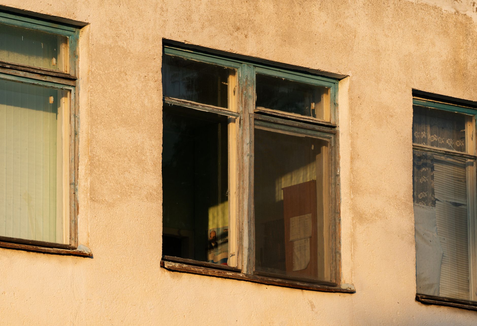 Old building facade with weathered windows and textured walls